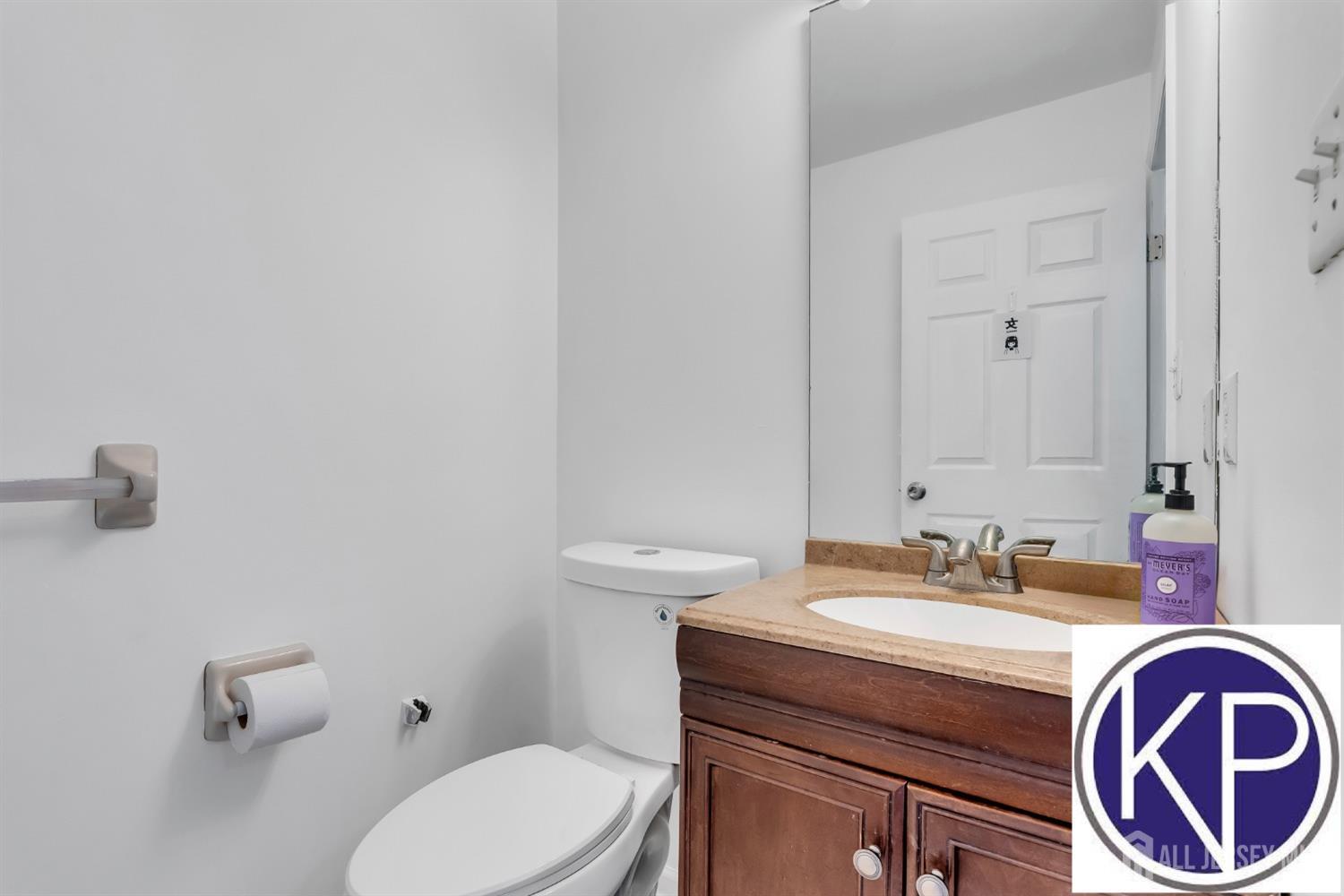 109 Jordan Road Colonia, NJ 07067 - Photo 15 of 30 a bathroom with a sink a toilet and a mirror