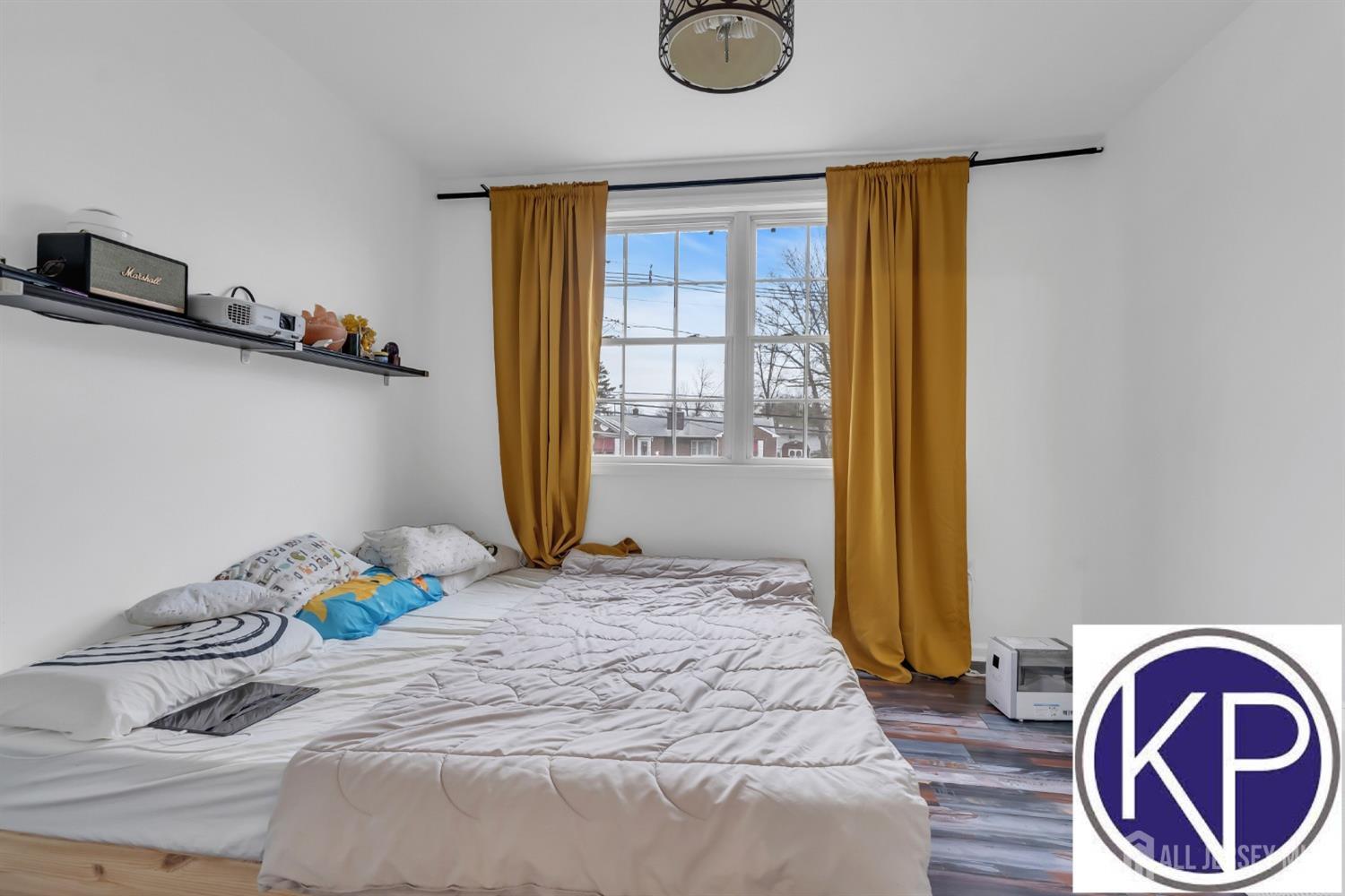 109 Jordan Road Colonia, NJ 07067 - Photo 19 of 30 a bedroom with a bed and a window