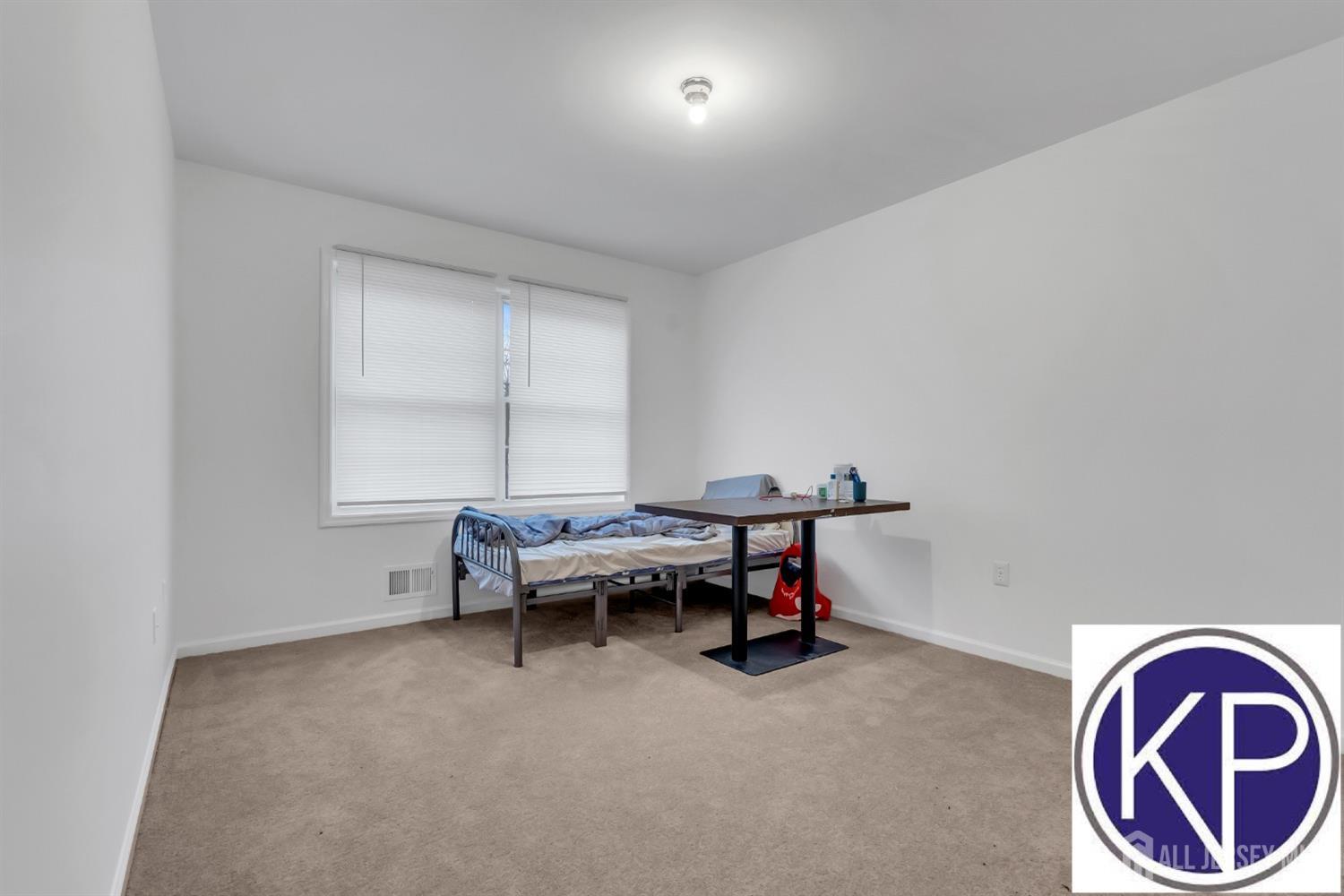 109 Jordan Road Colonia, NJ 07067 - Photo 22 of 30 a living room with furniture and a window