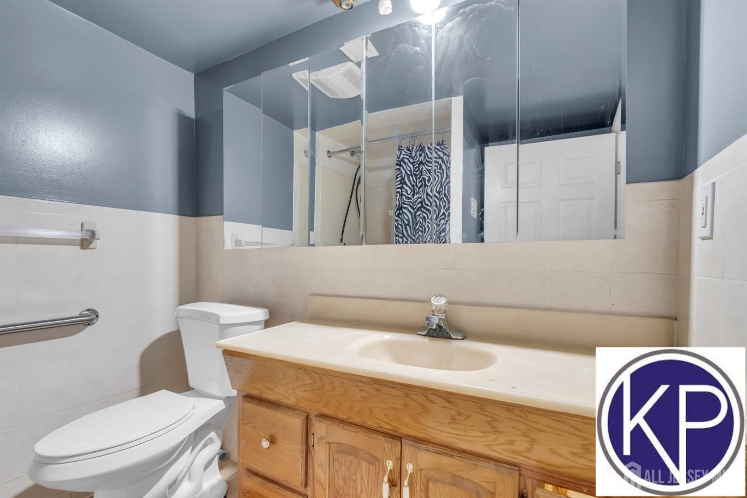 109 Jordan Road Colonia, NJ 07067 - Photo 24 of 30 a bathroom with a sink mirror vanity and toilet