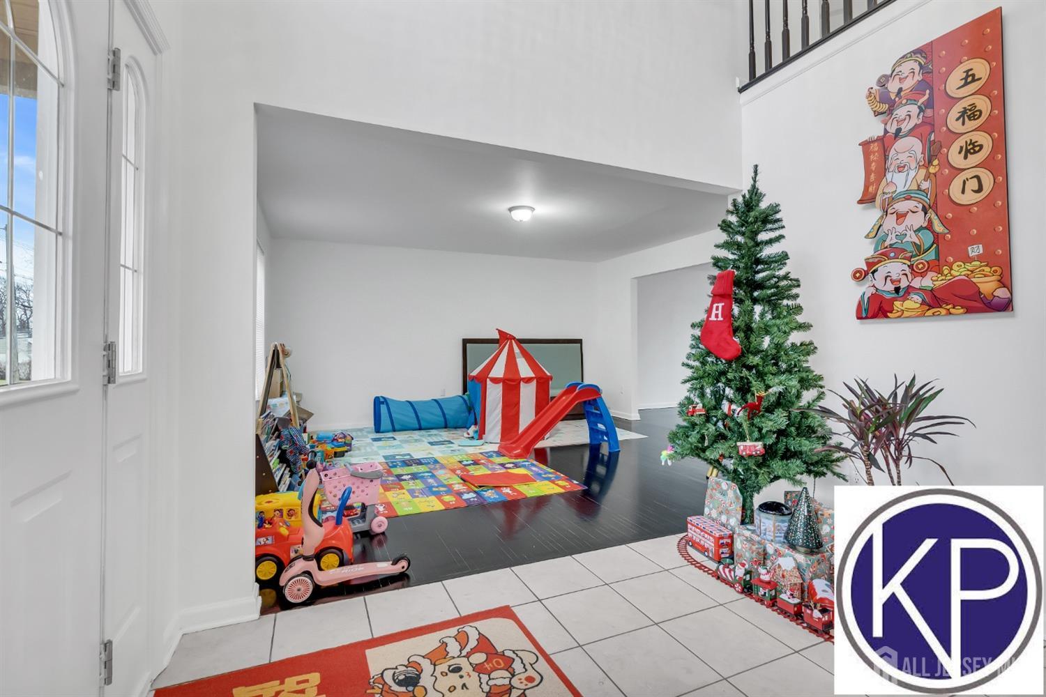 109 Jordan Road Colonia, NJ 07067 - Photo 6 of 30 wooden floor with toys and flowers