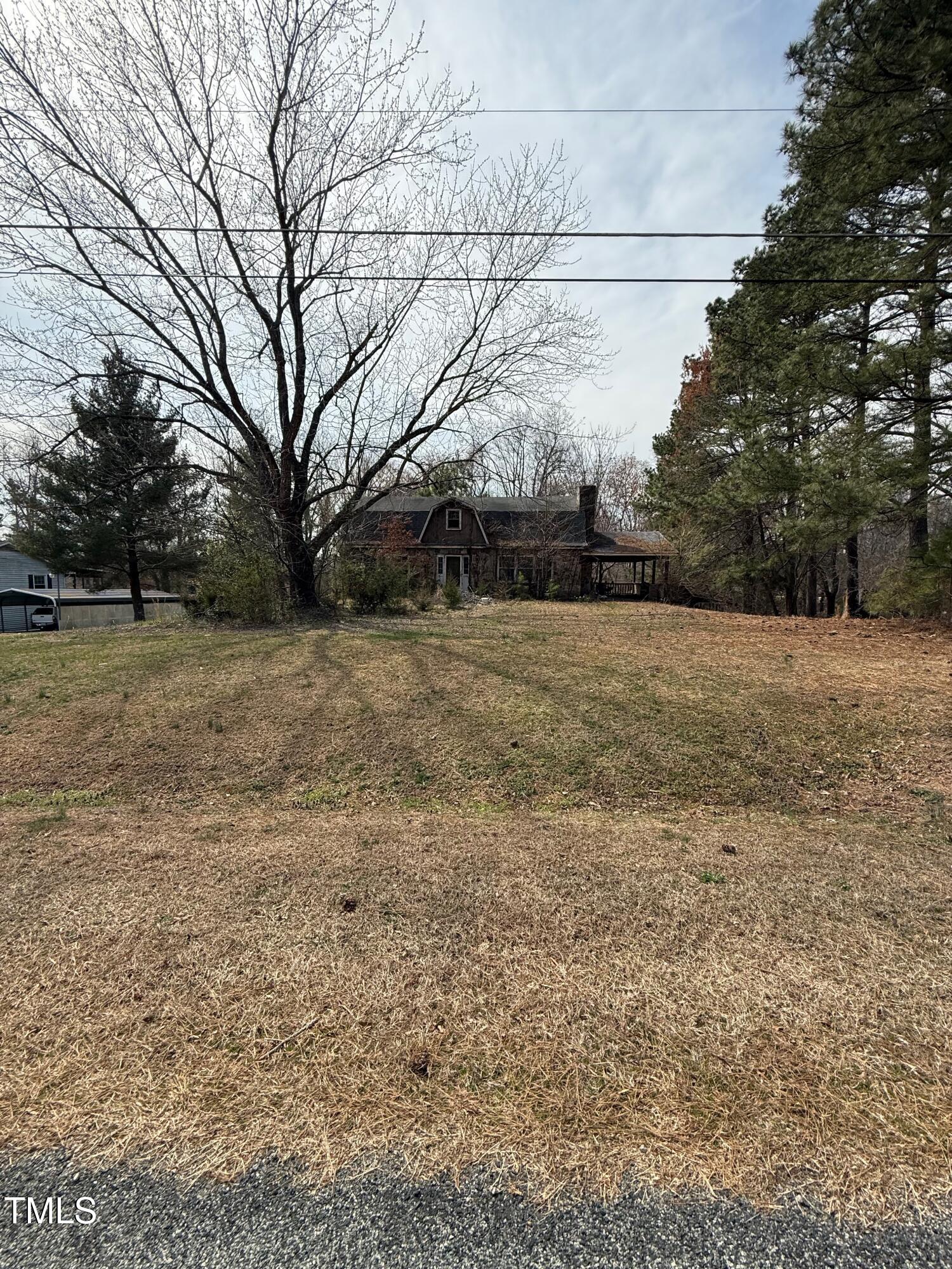 96 Stephens Road Providence, NC 27315 - Photo 1 of 7 a view of dirt yard with large trees