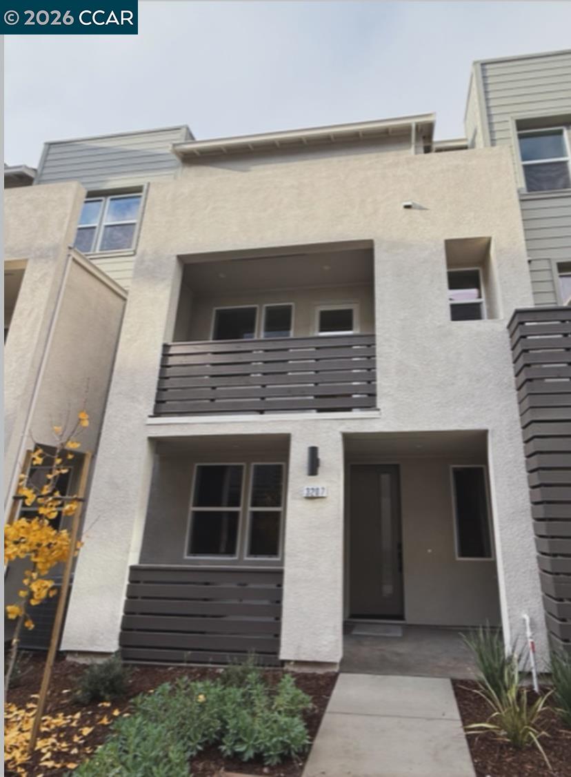 a front view of a house with garage