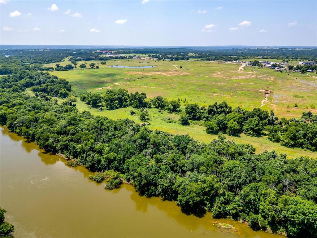 1152 County Road 317 Rainbow, TX 76077 - Photo 5 of 17 a view of a lake with a building in the background
