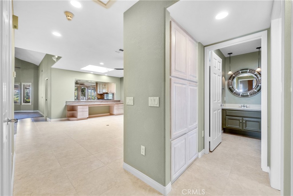 4729 Majorca Way Oceanside, CA 92056 - Photo 7 of 32 a view of a hallway and a livingroom with furniture
