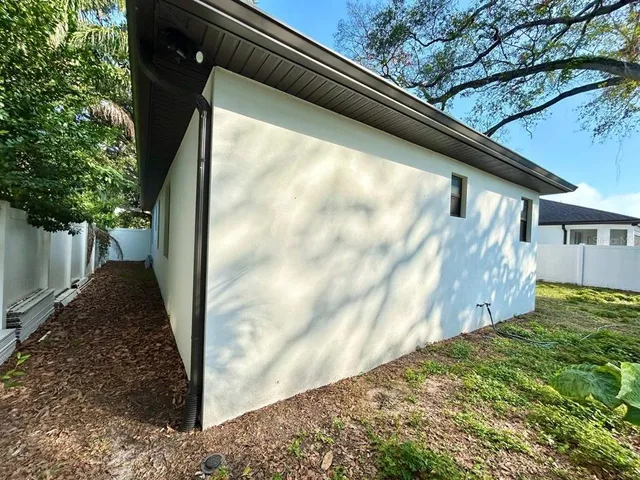 a view of back yard of a house