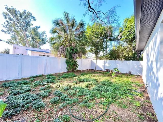 a backyard of a house with lots of green space