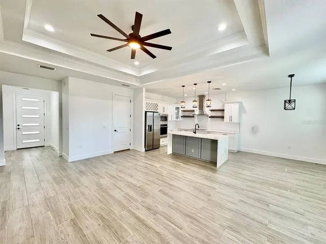 a view of a kitchen with a sink and a stove top oven