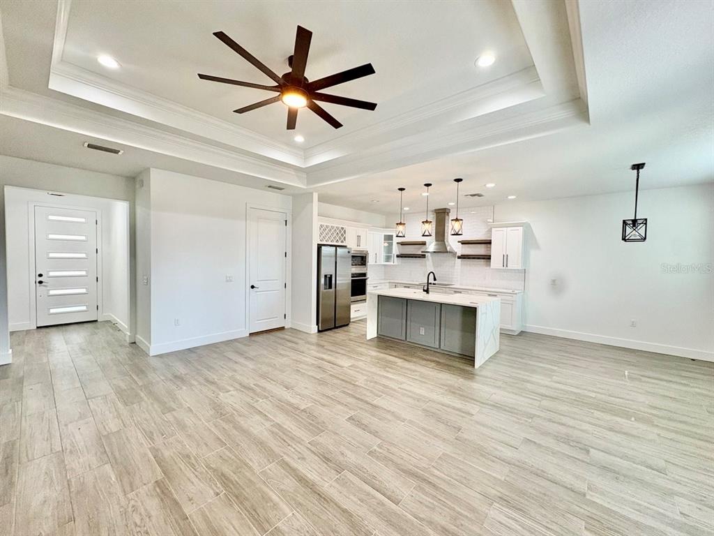 3228 West Beach Street Tampa, FL 33607 - Photo 4 of 22 a view of a kitchen with a sink and a stove top oven