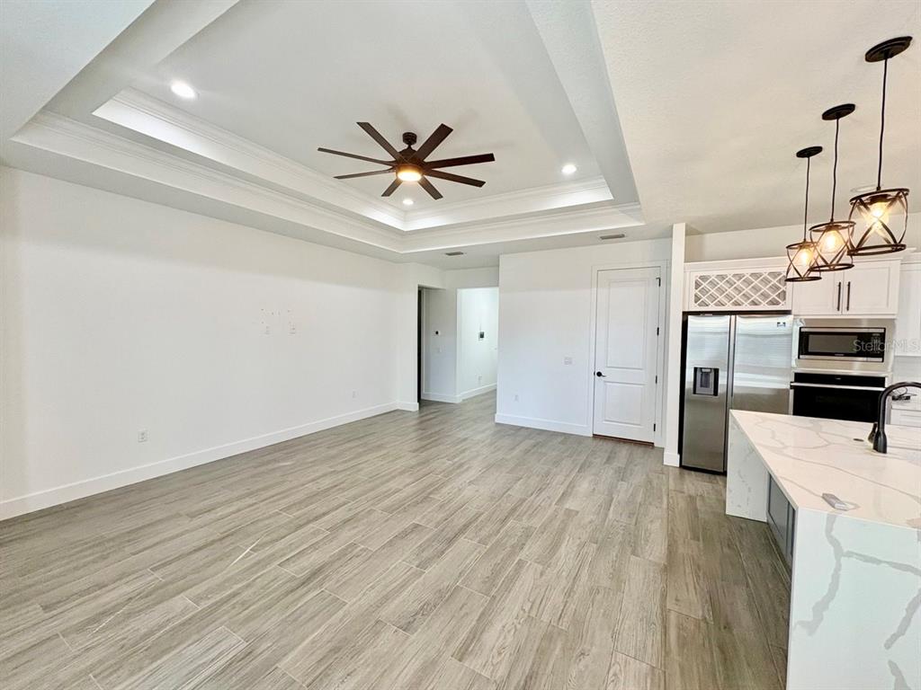 3228 West Beach Street Tampa, FL 33607 - Photo 6 of 22 a view of a kitchen with a sink and stainless steel appliances