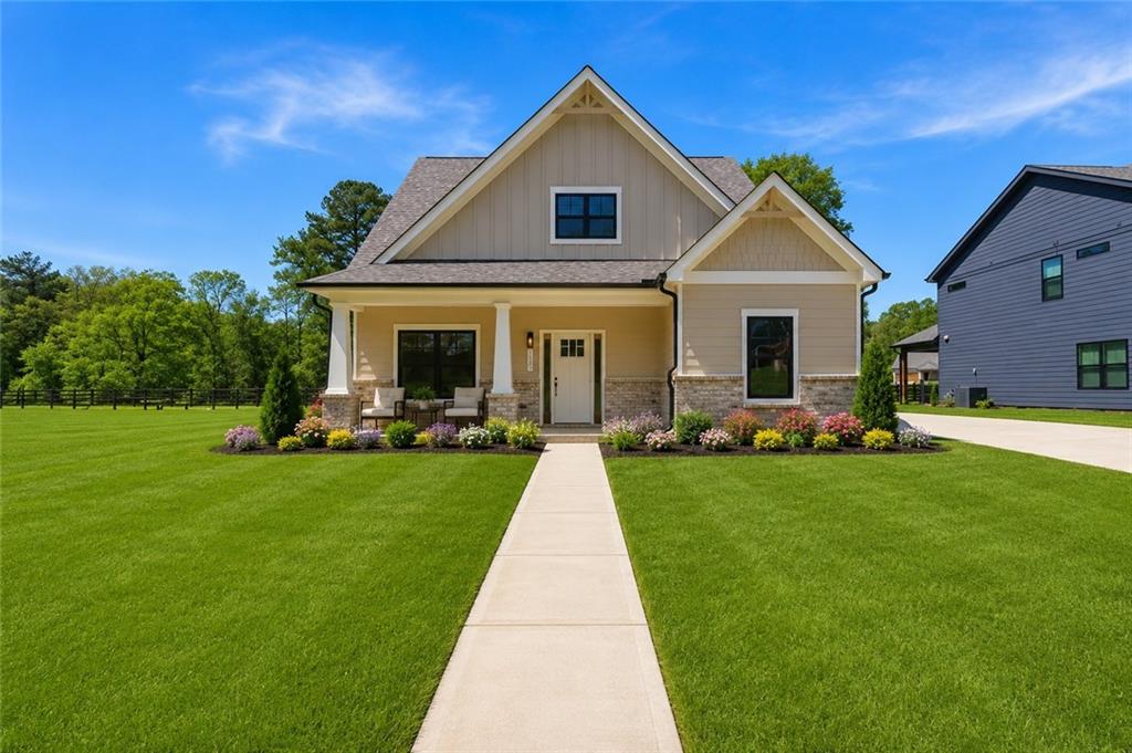 44 Puckett Road Emerson, GA 30137 - Photo 2 of 38 a front view of house with yard and green space