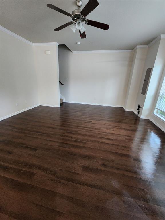 5516 Del Rey Drive Denton, TX 76208 - Photo 6 of 16 a view of an empty room with wooden floor and a ceiling fan
