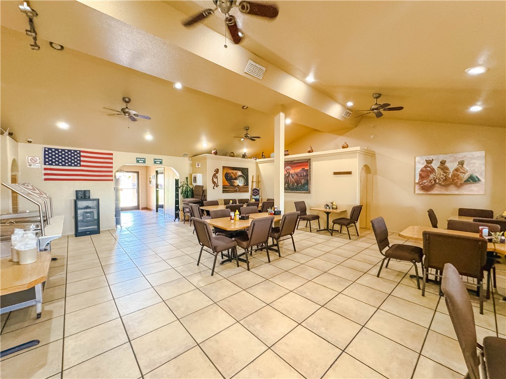 9368 Branded Road Kingman, AZ 86401 - Photo 29 of 32 a living room with couches and kitchen view with wooden floor