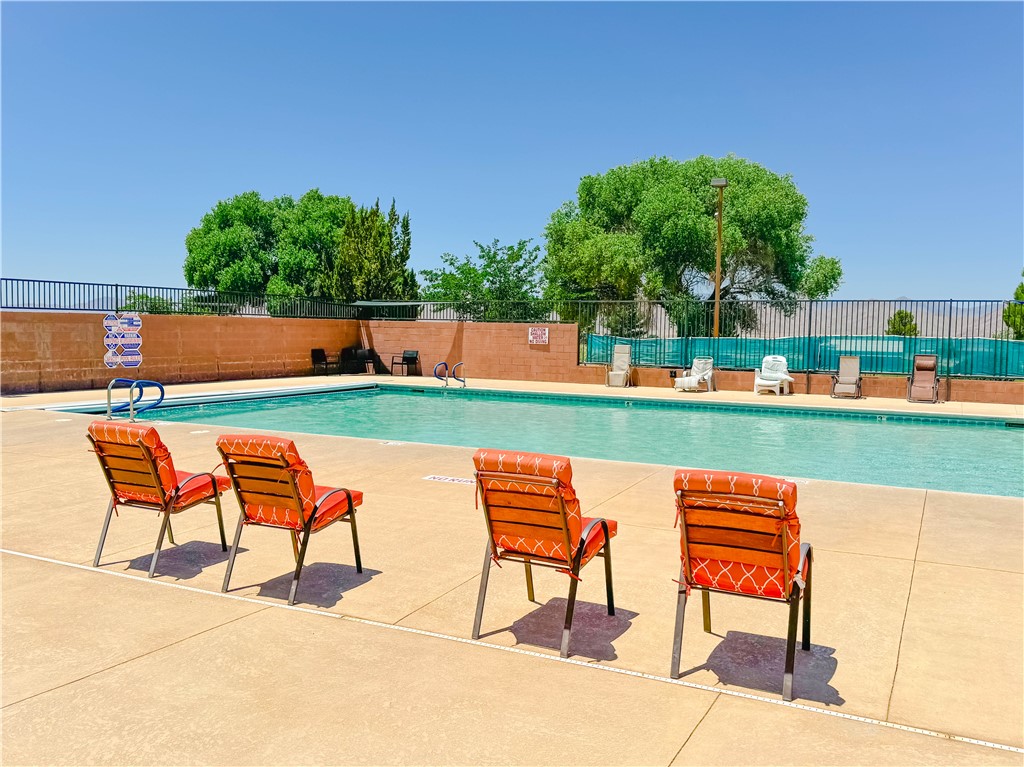 9368 Branded Road Kingman, AZ 86401 - Photo 32 of 32 an outdoor sitting area with chairs and a table