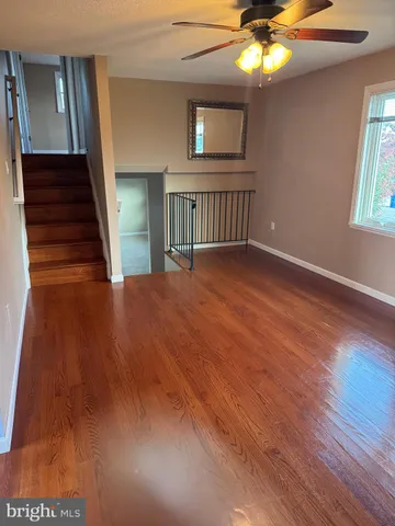 a view of empty room with window and fireplace