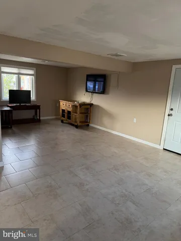 a view of livingroom with furniture and white walls