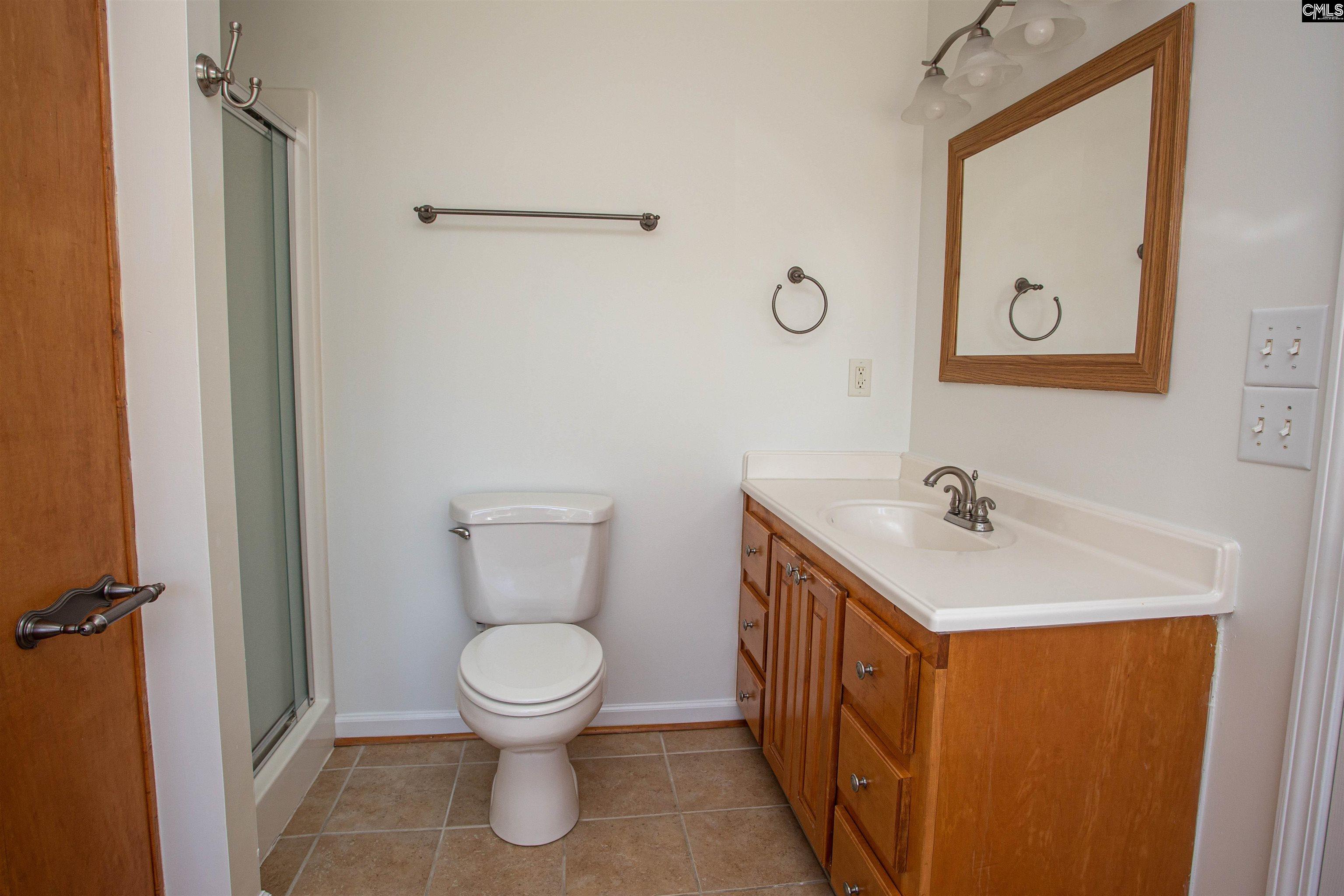 1700 Broad Street Camden, SC 29020 - Photo 27 of 41 a bathroom with a sink a toilet and a mirror