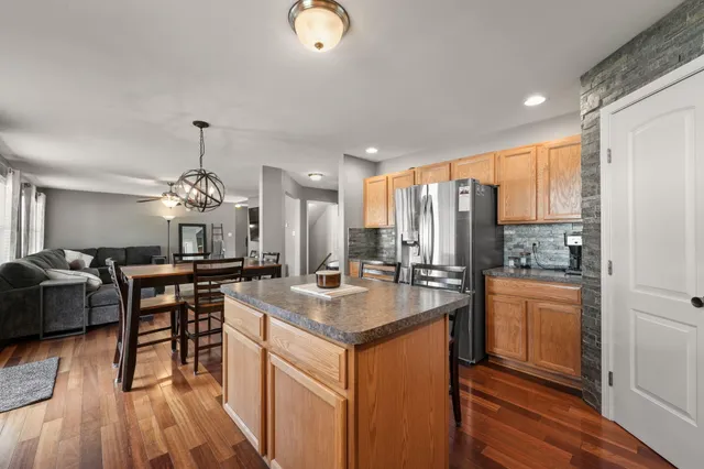 a kitchen with a sink stove and refrigerator