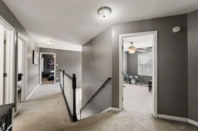 a view of a hallway with furniture and a livingroom view