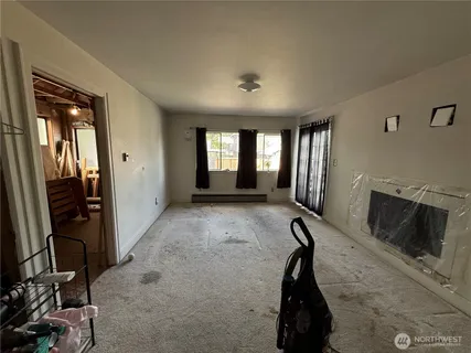 a room with gym equipment and windows