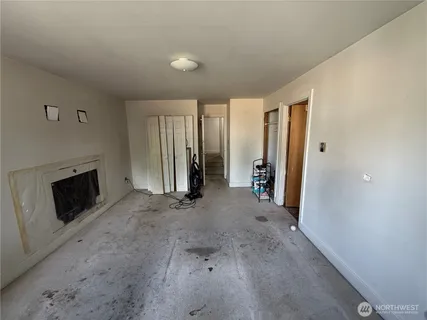 a view of a livingroom with furniture and a fireplace