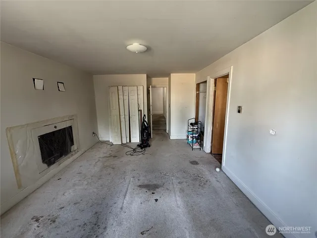 a view of a livingroom with furniture and a fireplace
