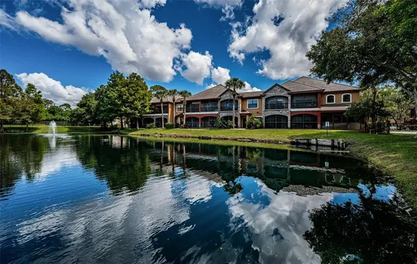 a front view of a house with a lake view