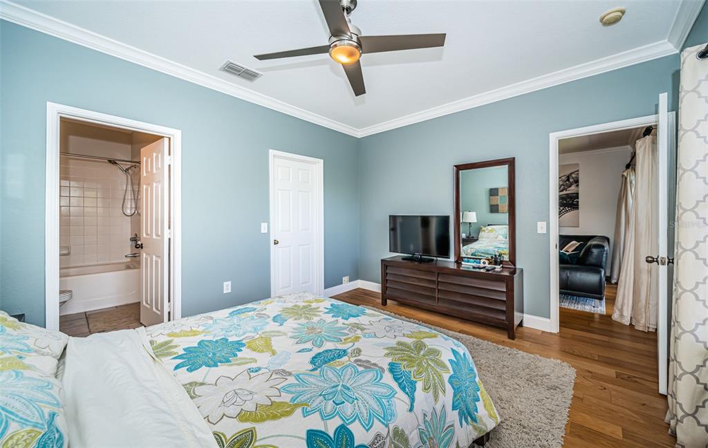 2138 Chianti Place, Unit 142 Palm Harbor, FL 34683 - Photo 14 of 40 a bedroom with a bed and wooden floor