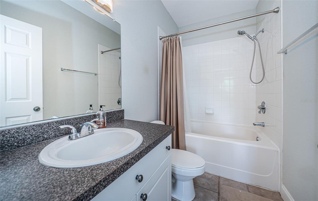 2138 Chianti Place, Unit 142 Palm Harbor, FL 34683 - Photo 15 of 40 a bathroom with a sink toilet and shower