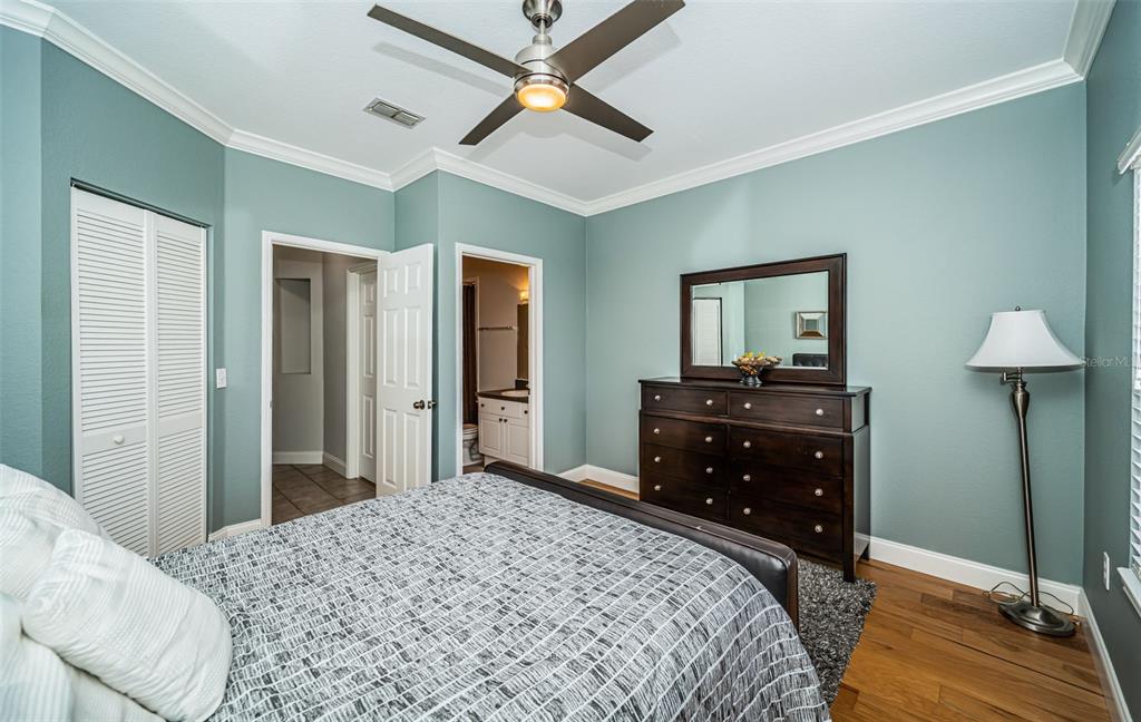 2138 Chianti Place, Unit 142 Palm Harbor, FL 34683 - Photo 17 of 40 a bedroom with a bed and a dresser