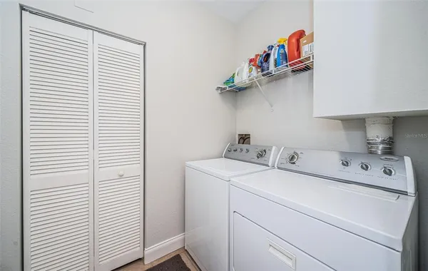 a utility room with dryer and washer