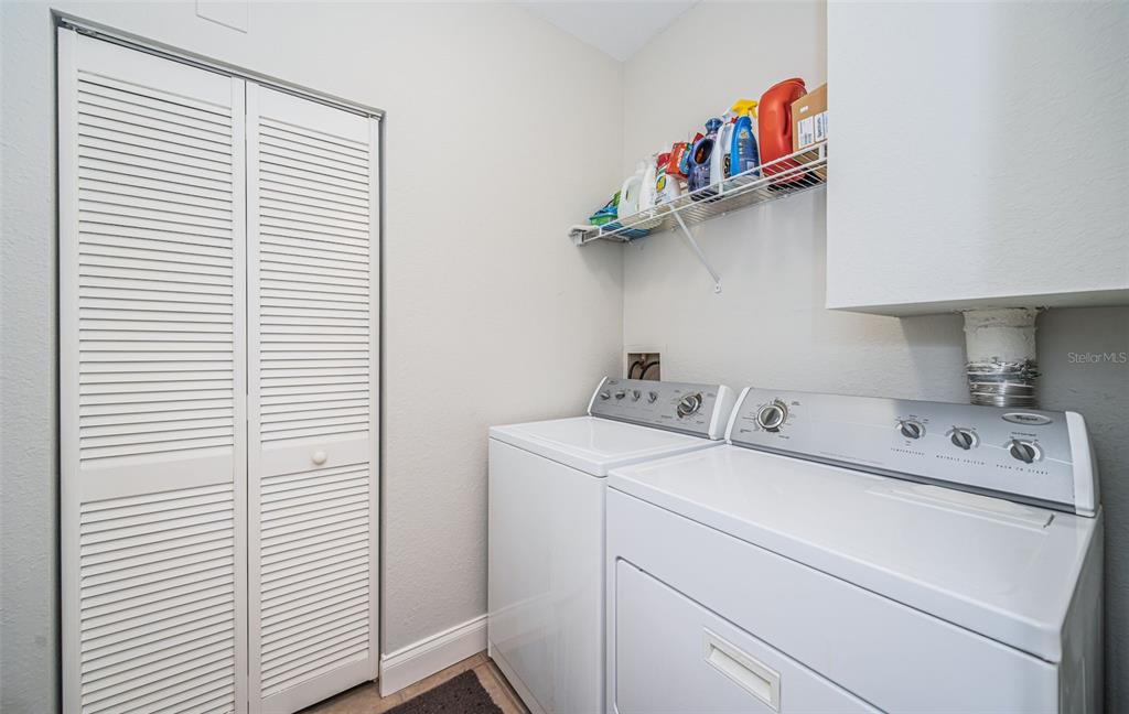 2138 Chianti Place, Unit 142 Palm Harbor, FL 34683 - Photo 19 of 40 a utility room with dryer and washer