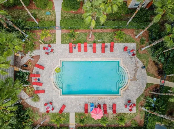 a view of a swimming pool with sitting area