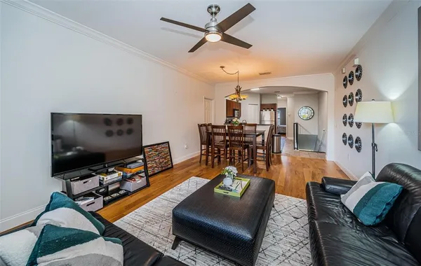 a living room with furniture and a flat screen tv