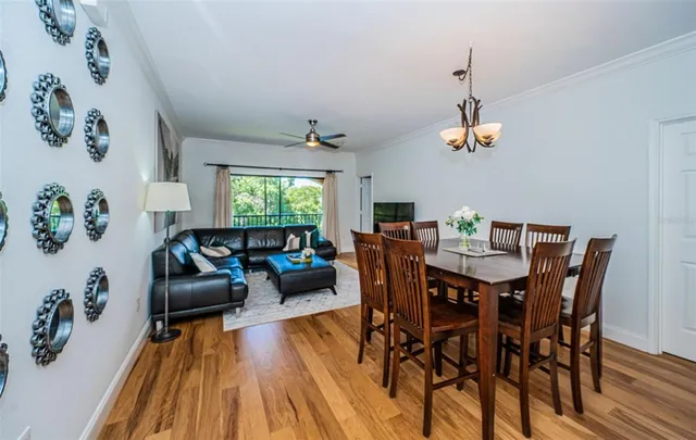 a view of a dining room with furniture window and wooden floor
