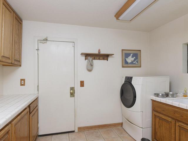 14544 Cedar Ridge Court Poway, CA 92064 - Photo 22 of 25 Large Laundry Room off of Garage