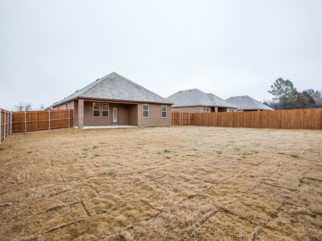 123 Lakeview Circle Pilot Point, TX 76258 - Photo 35 of 39 a front view of a house with a yard
