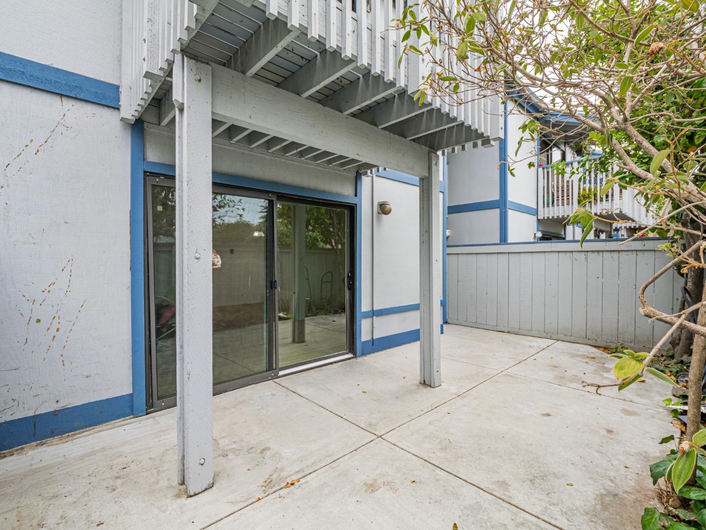 1925 46th Avenue, Unit 71 Capitola, CA 95010 - Photo 20 of 36 a view of a porch with a wooden fence