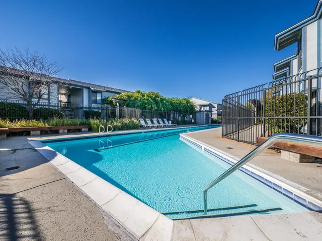 a view of a swimming pool with a lounge chair