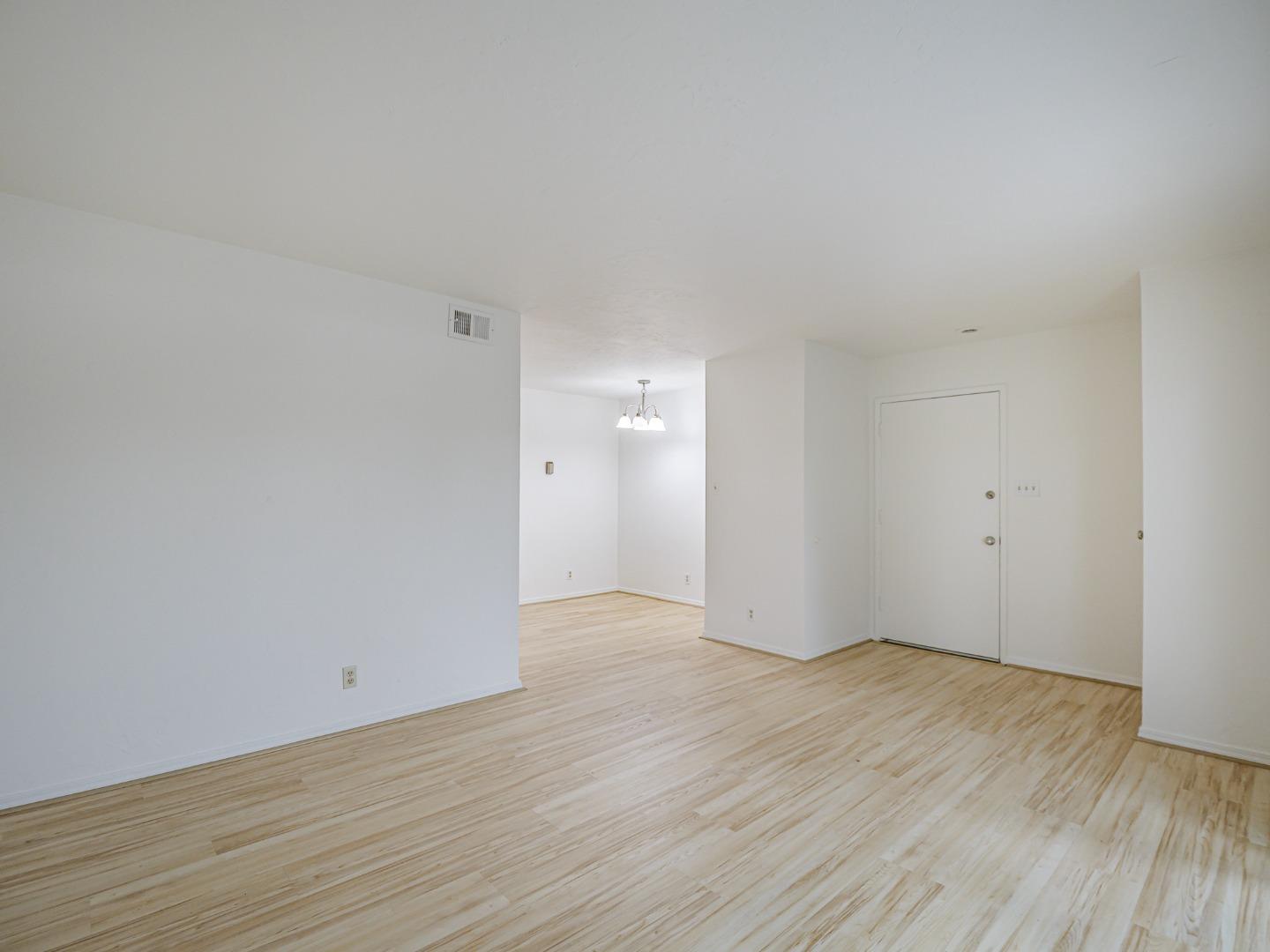 1925 46th Avenue, Unit 71 Capitola, CA 95010 - Photo 7 of 36 a view of an empty room with wooden floor