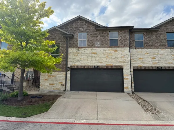 a front view of house with garage