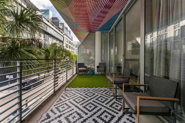 a view of a backyard with sitting area