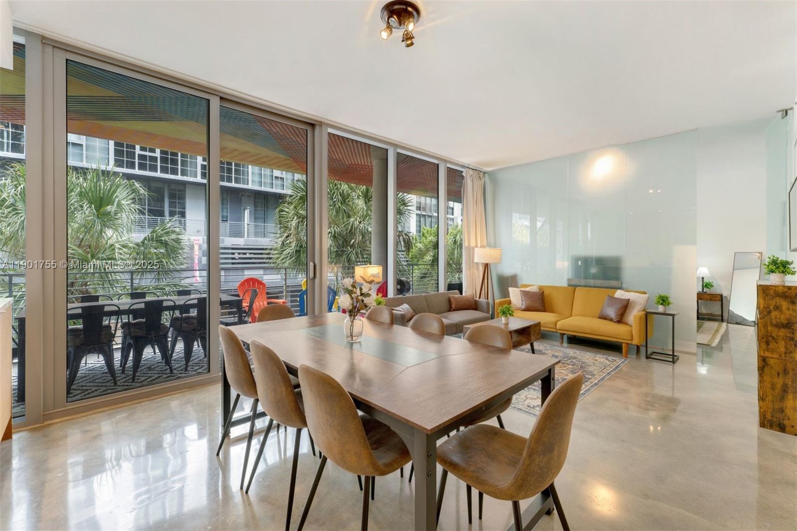 250 Northwest 24th Street, Unit 2B Miami, FL 33127 - Photo 2 of 16 a view of a dining room and livingroom view