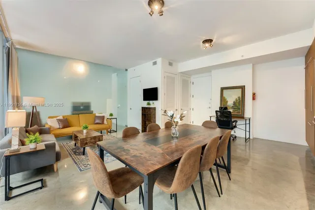 a view of a dining room with furniture