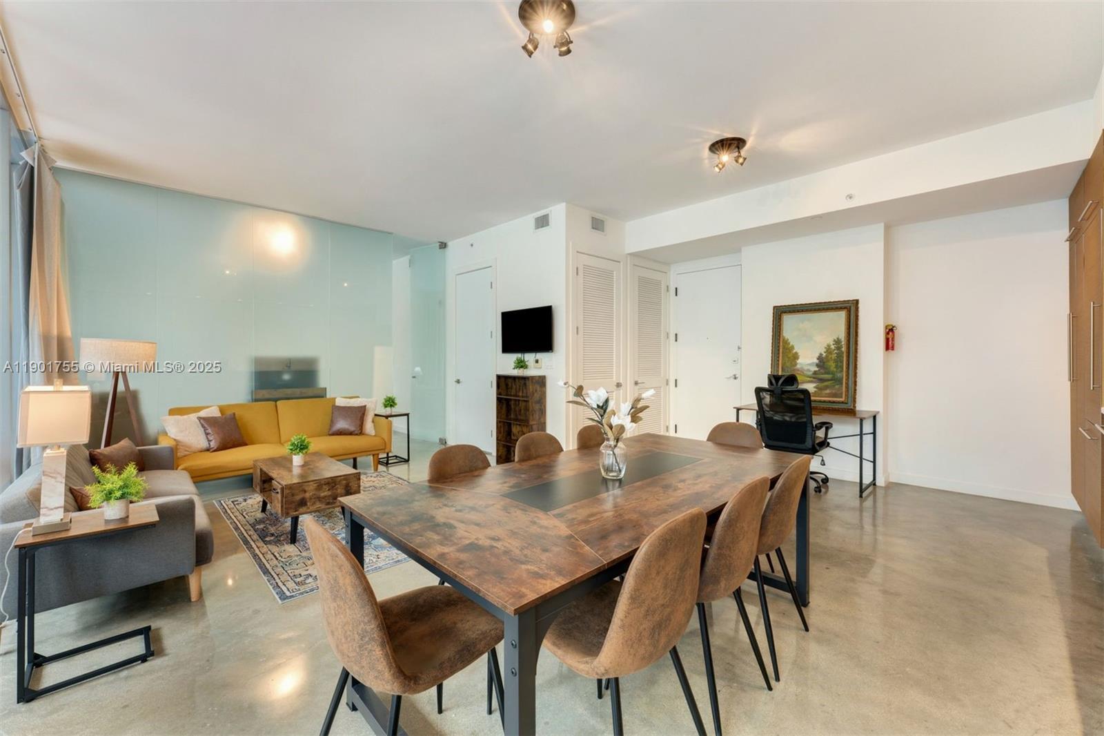 250 Northwest 24th Street, Unit 2B Miami, FL 33127 - Photo 3 of 16 a view of a dining room with furniture