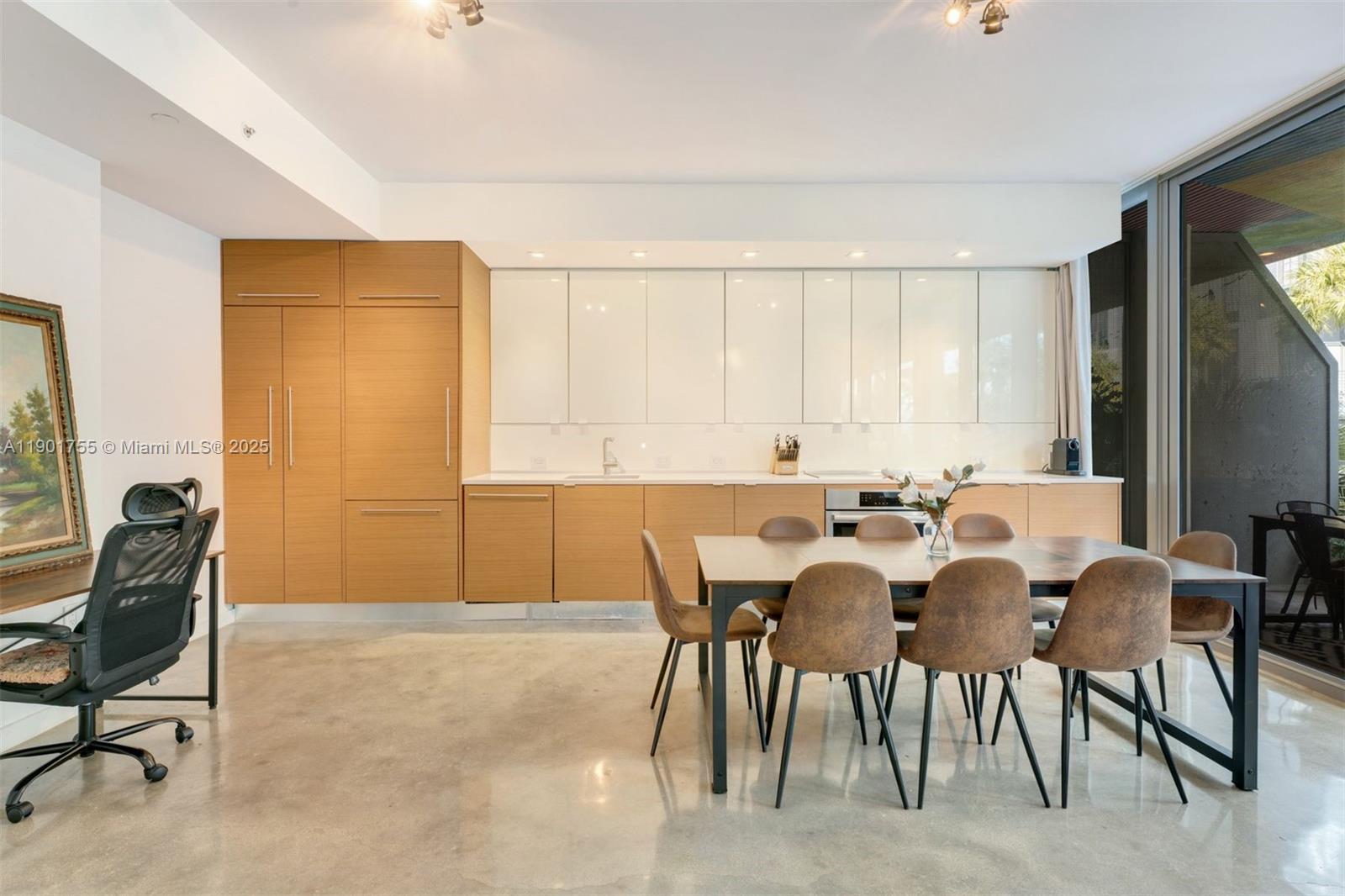250 Northwest 24th Street, Unit 2B Miami, FL 33127 - Photo 4 of 16 a view of a dining room with furniture and a window