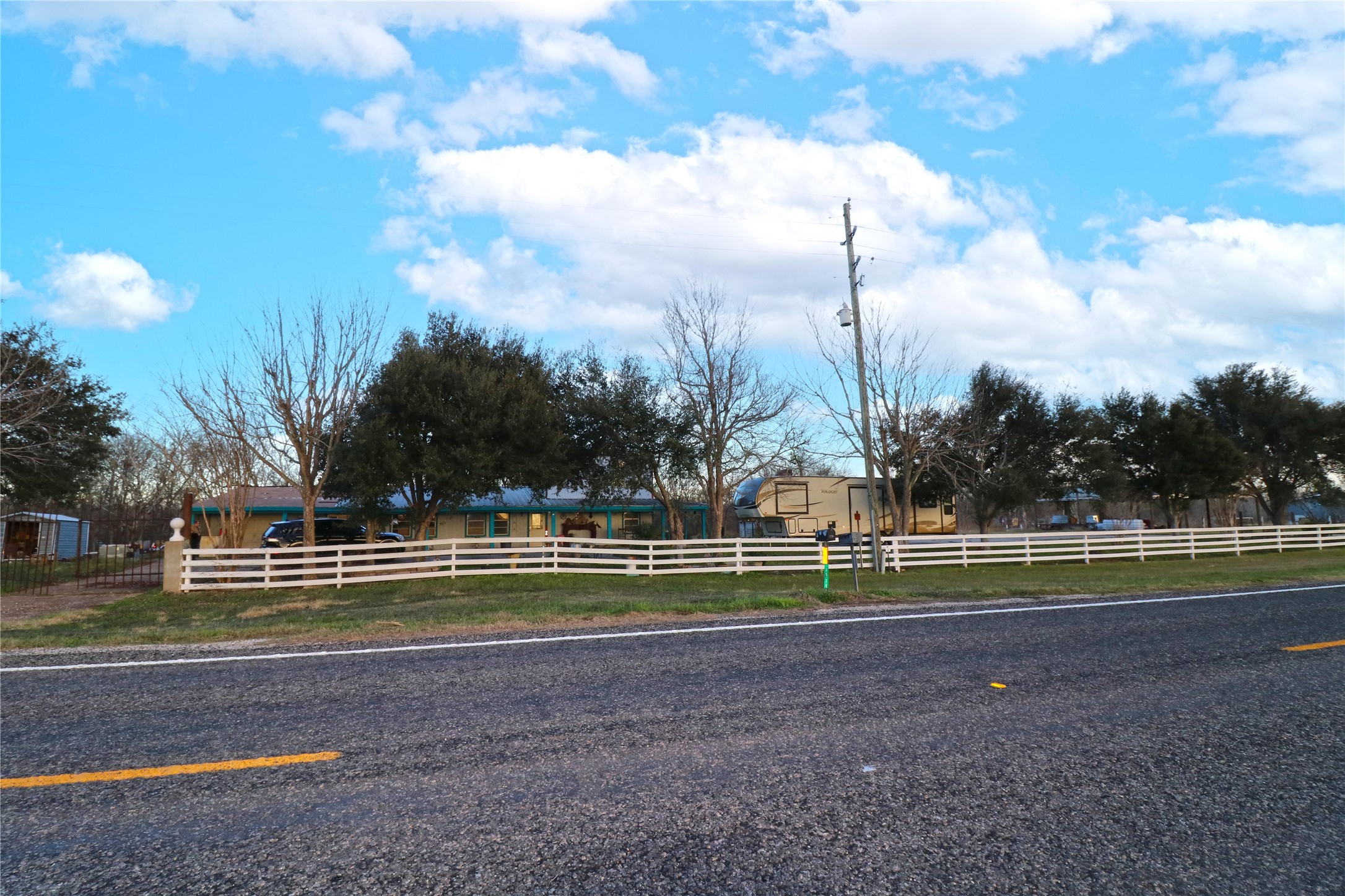 7738 North Farm To Market 331 Road Bellville, TX 77418 - Photo 6 of 41 a view of a entertaining space in front of a house