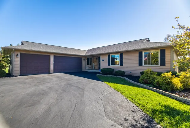 a front view of a house with garden