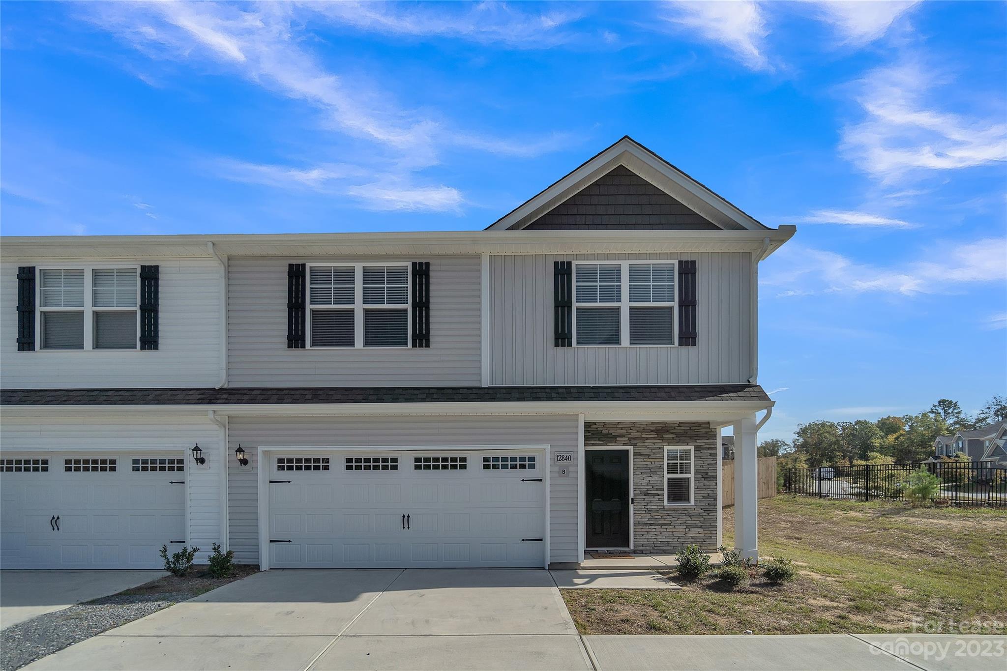 12840 Statesville Road, Unit 15B Huntersville, NC 28078 - Photo 1 of 37 a view of a house with a yard