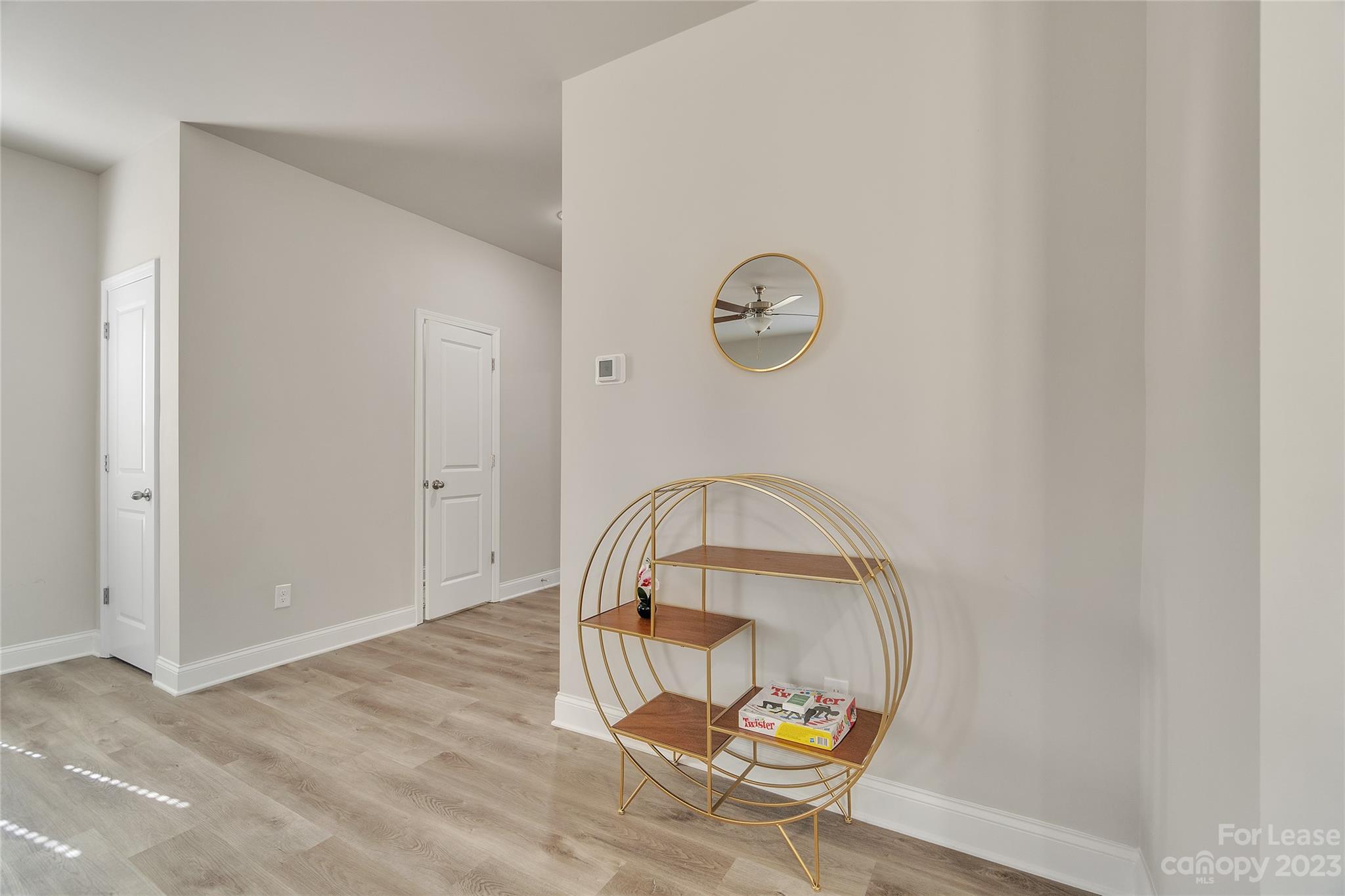 12840 Statesville Road, Unit 15B Huntersville, NC 28078 - Photo 16 of 37 an empty room with wooden floor and glass door